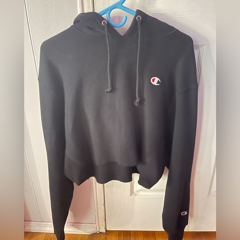 Cropped black worn before champion hoodie.